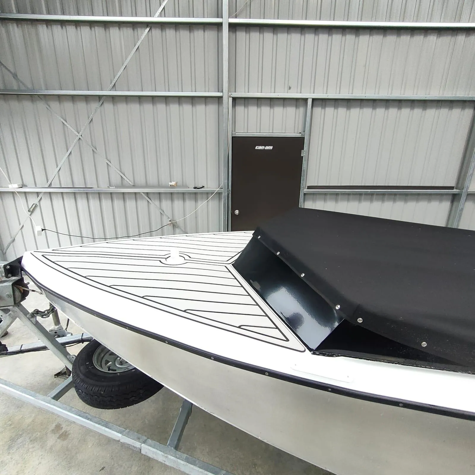 Custom-fitted boat cover with U-Dek decking, patterned at the Canvasland workshop