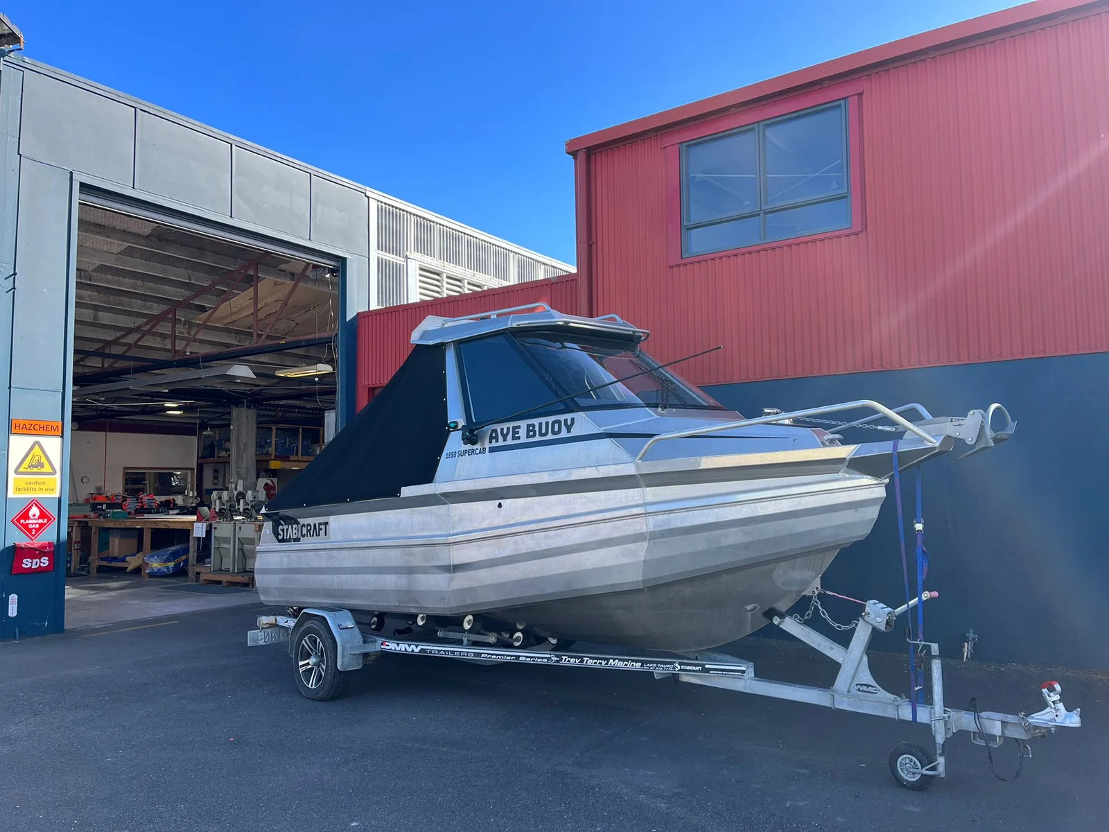 Custom canvas cabin cover fitted to a Stabicraft boat on its trailer
