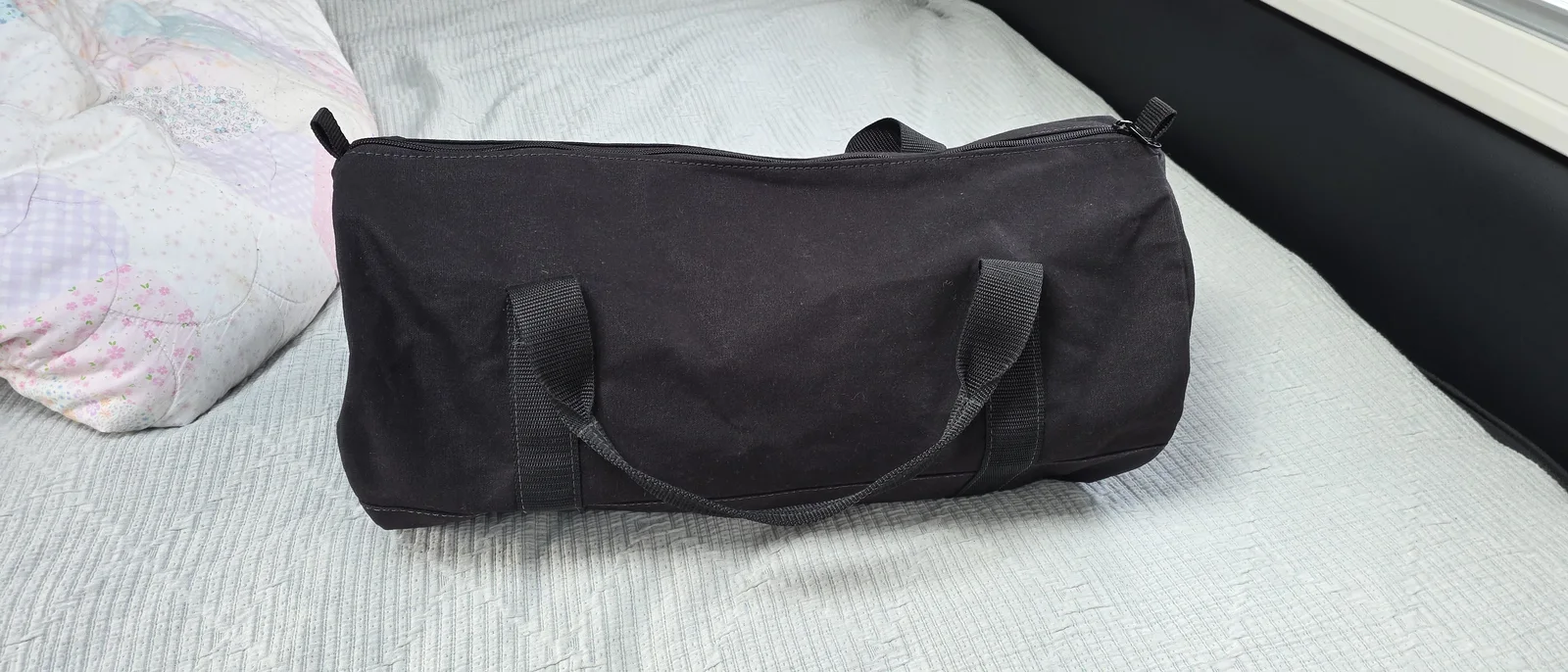 Black canvas duffle-style gear bag