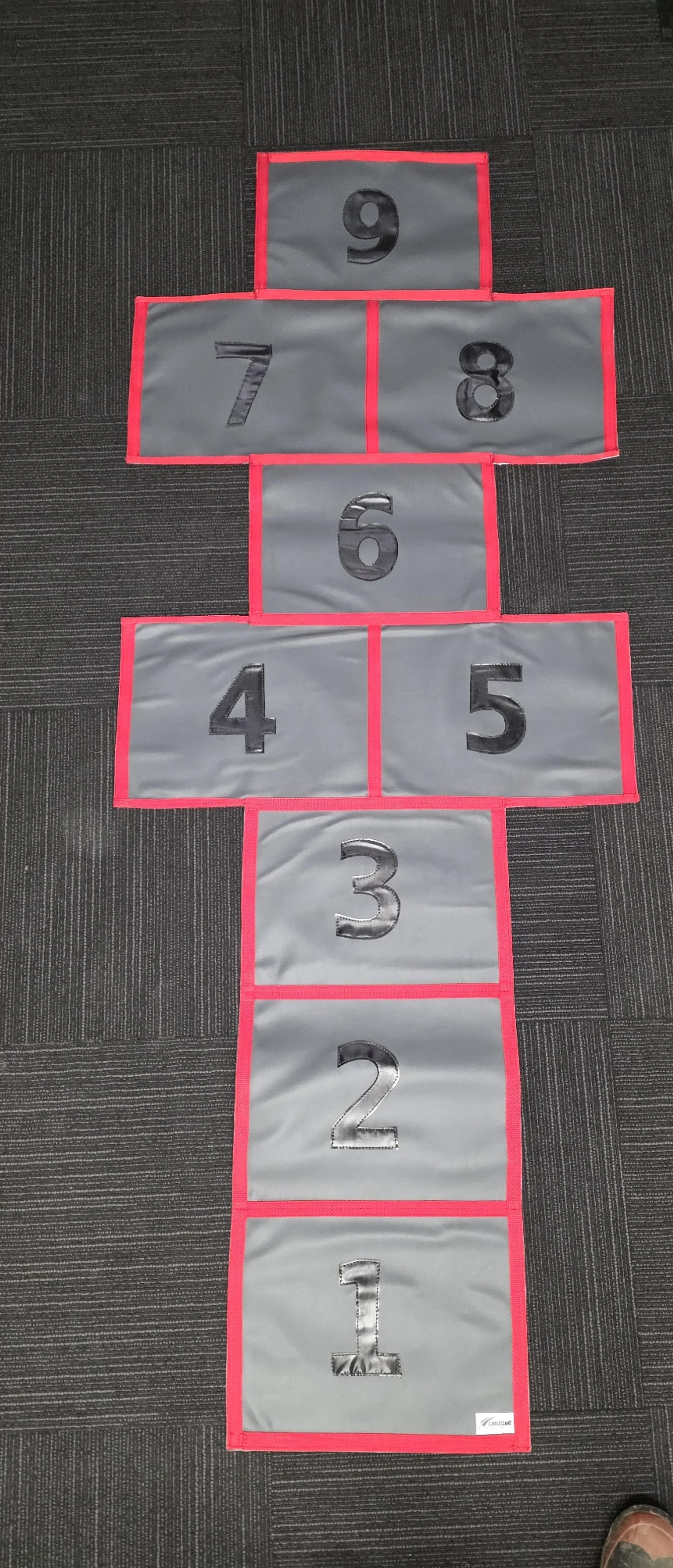 PVC hopscotch board laid out for play