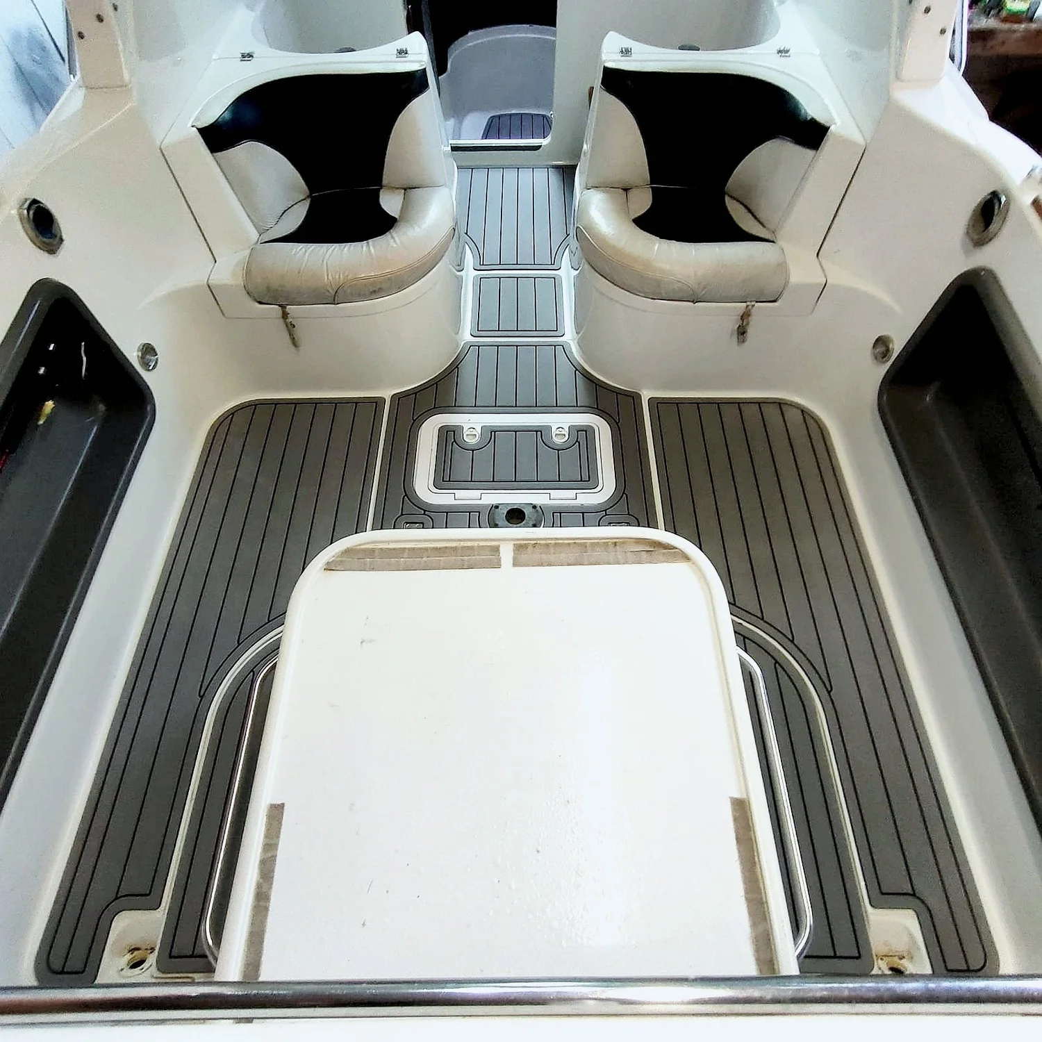 Marine upholstery — cushioned boat seating and fold-down table
