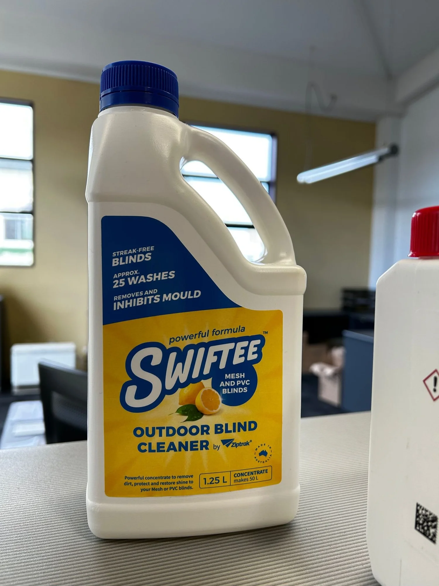 Bottle of Swiftee outdoor blind cleaner