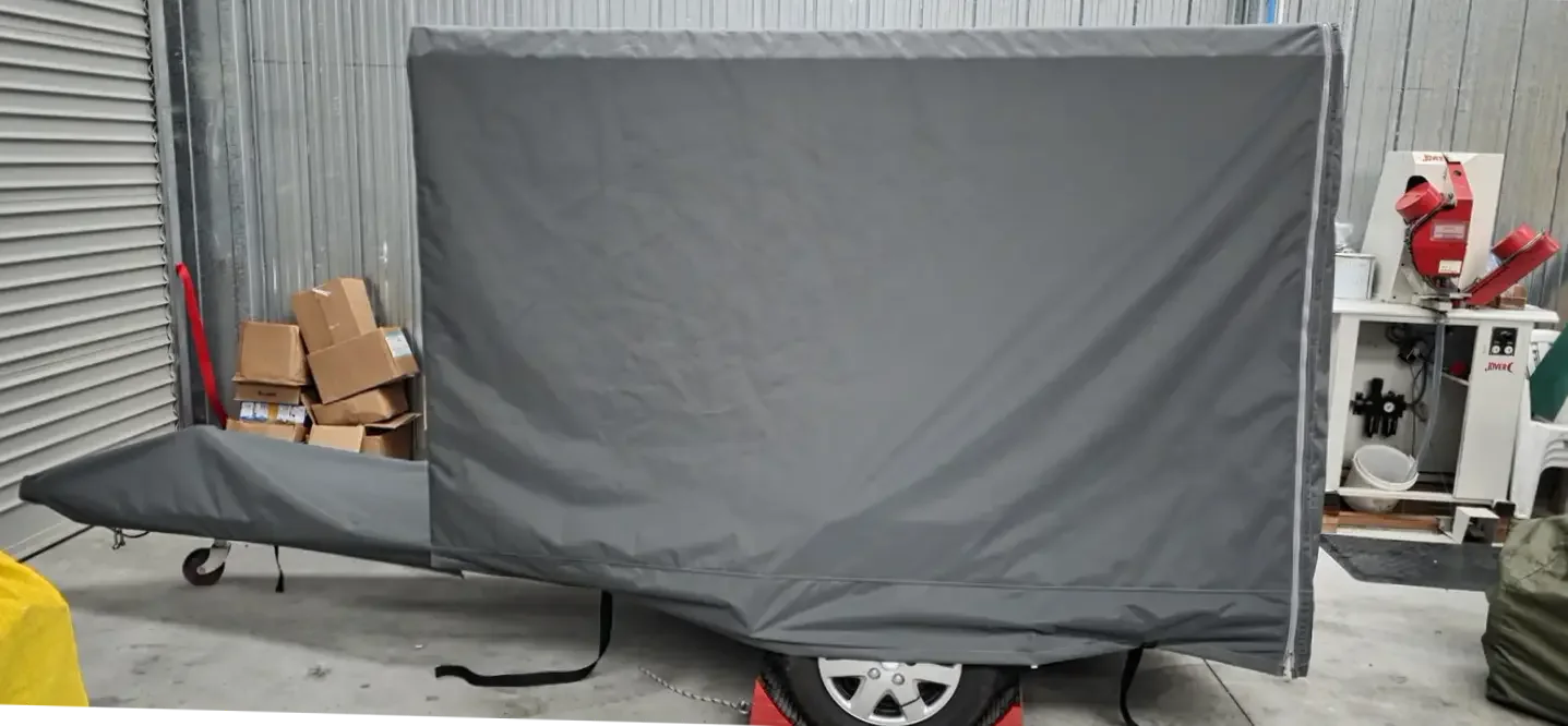 Grey PVC cover fitted to a trailer