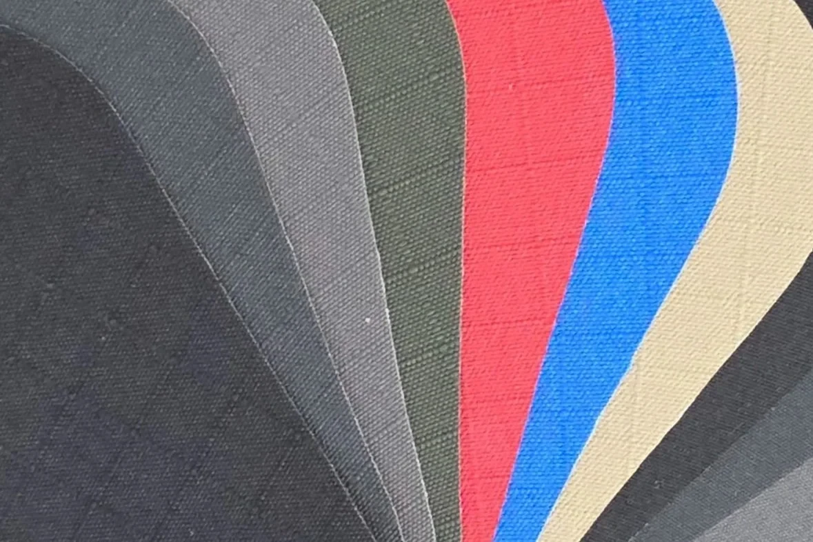 Canvas colour swatches for Canvasland ute canopies, fanned out to show the range