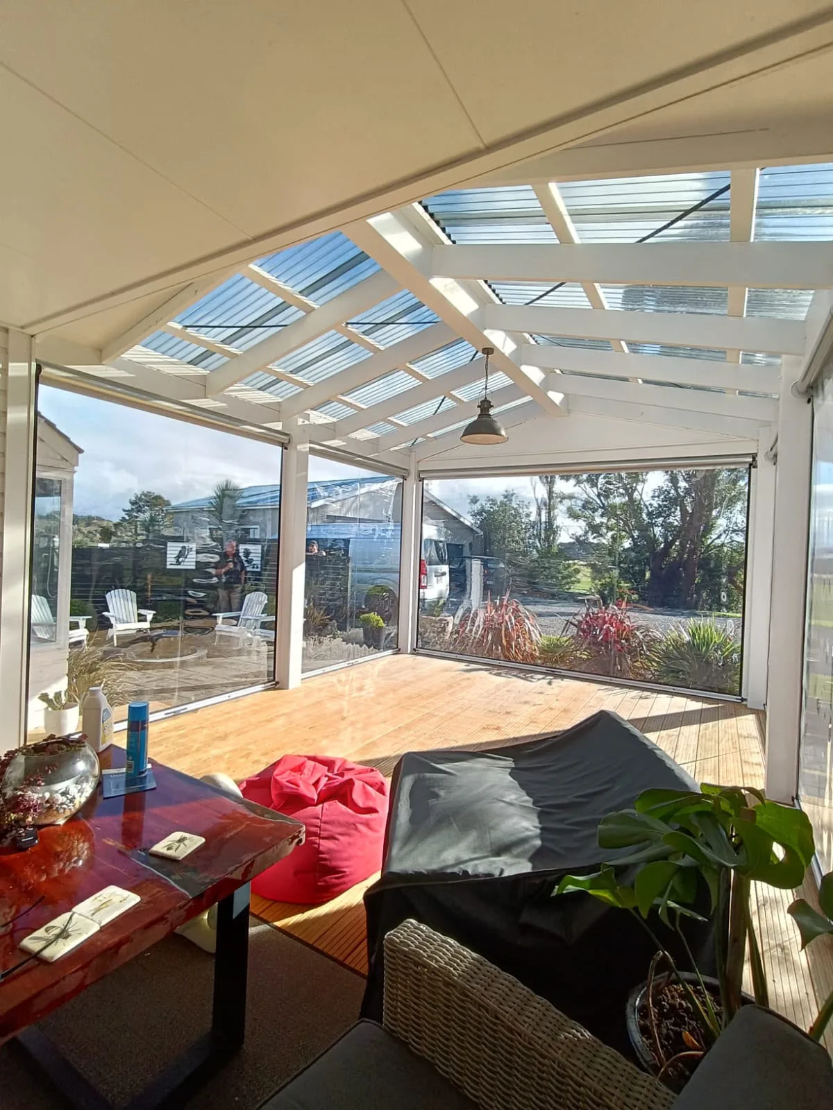 Looking out through Ziptrak blinds from inside a covered deck